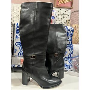 This is a pair of Coach Orchid boots in black leather with a block heel knee len